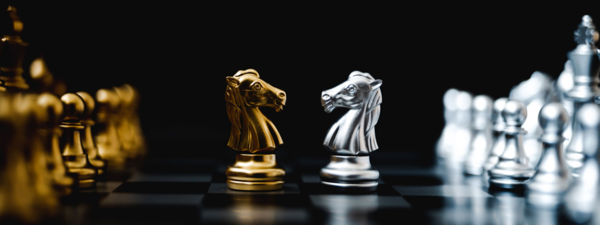 Business competition and strategy plan concept. Chess board game gold and silver colour-Shutterstock_1482321623